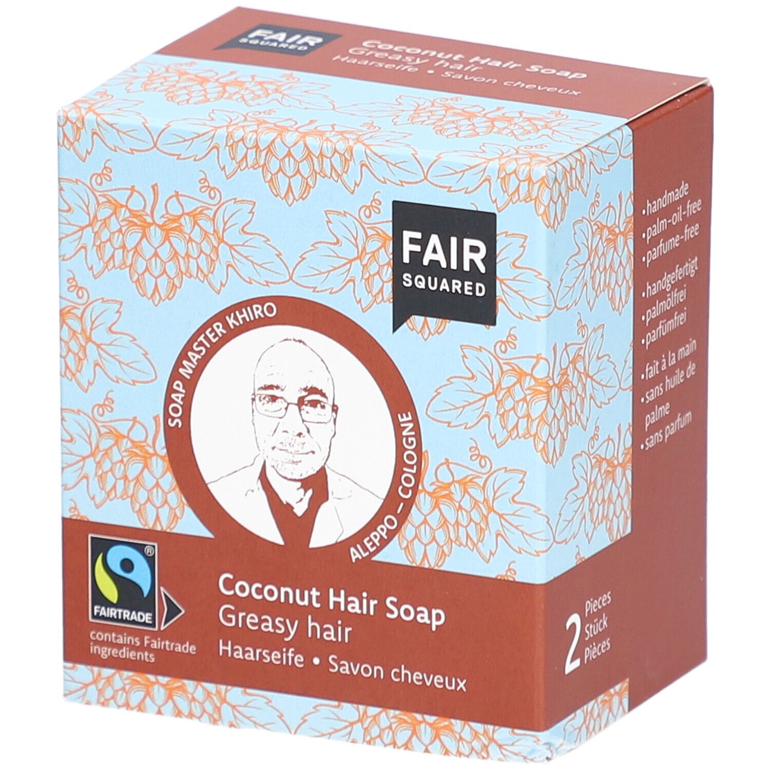 Boîte de FAIR SQUARED Haarseife Coco. Inscription : FAIR SQUARED, label Fairtrade, Soap Master Khiro, Savon cheveux coco, 2 pièces.