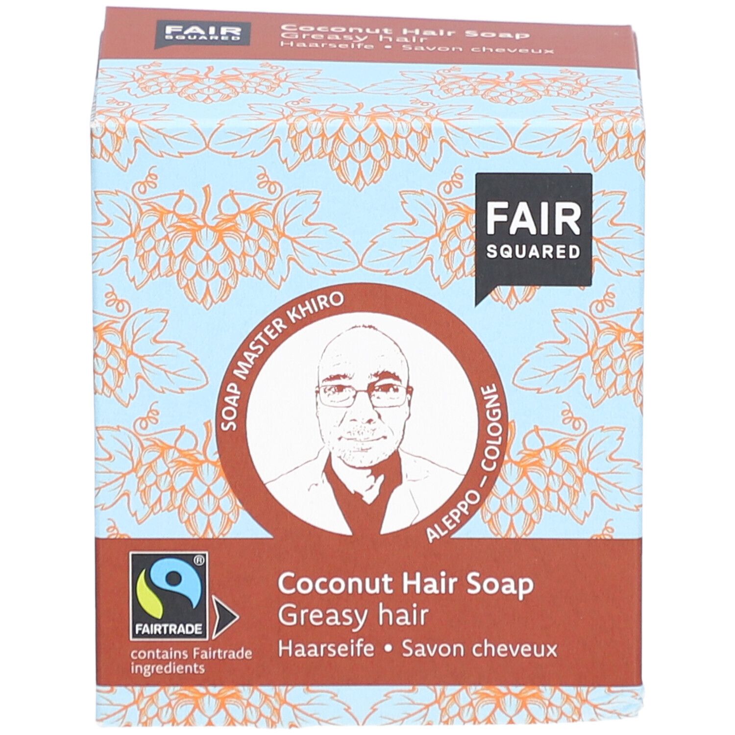 Boîte de FAIR SQUARED Haarseife Coco. Inscription : FAIR SQUARED, Soap Master Khiro, label Fairtrade, Savon cheveux coco, pour cheveux gras.