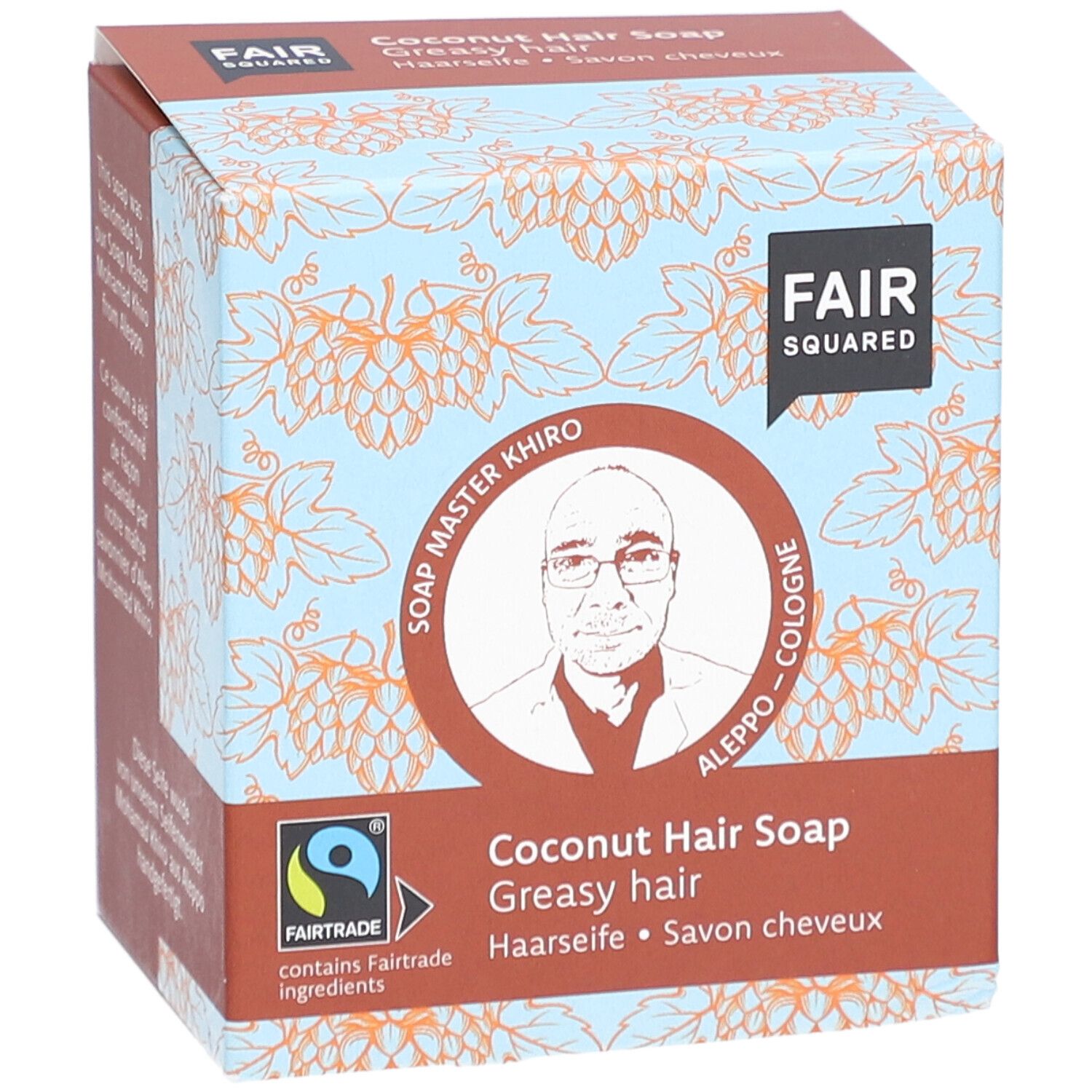 Boîte de FAIR SQUARED Haarseife Coco. Inscription : FAIR SQUARED, Soap Master Khiro, label Fairtrade, Savon cheveux coco, pour cheveux gras.