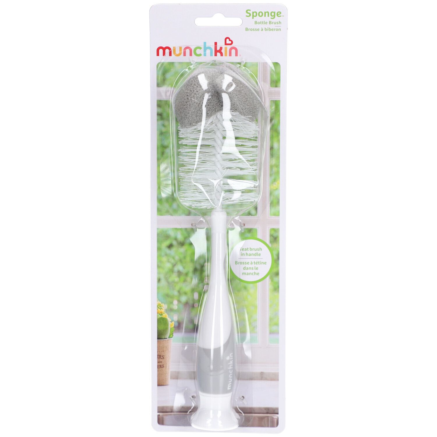 Brosse à biberon avec éponge et poils, dans son emballage. Marque visible.
