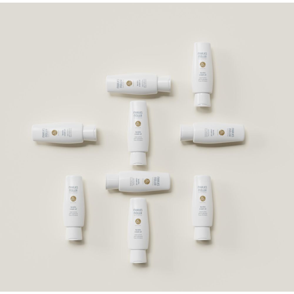 Plusieurs bouteilles Marlies Möller Keratin Cream Oil disposées.