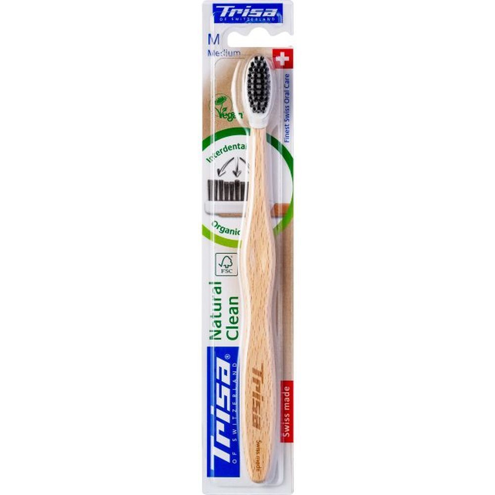 Brosse à dents TRISA Medium Natural Clean, manche en bois, poils noirs, emballée.
