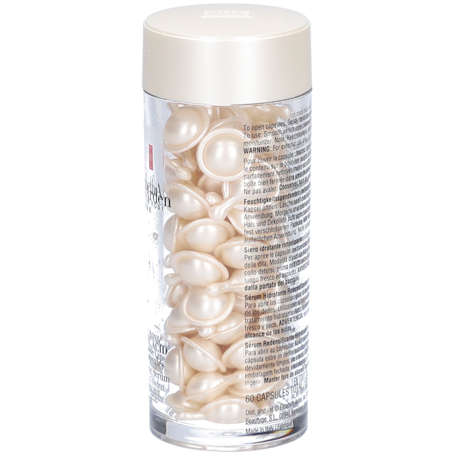 Récipient transparent avec capsules. Couvercle crème. Inscription: Elizabeth Arden.