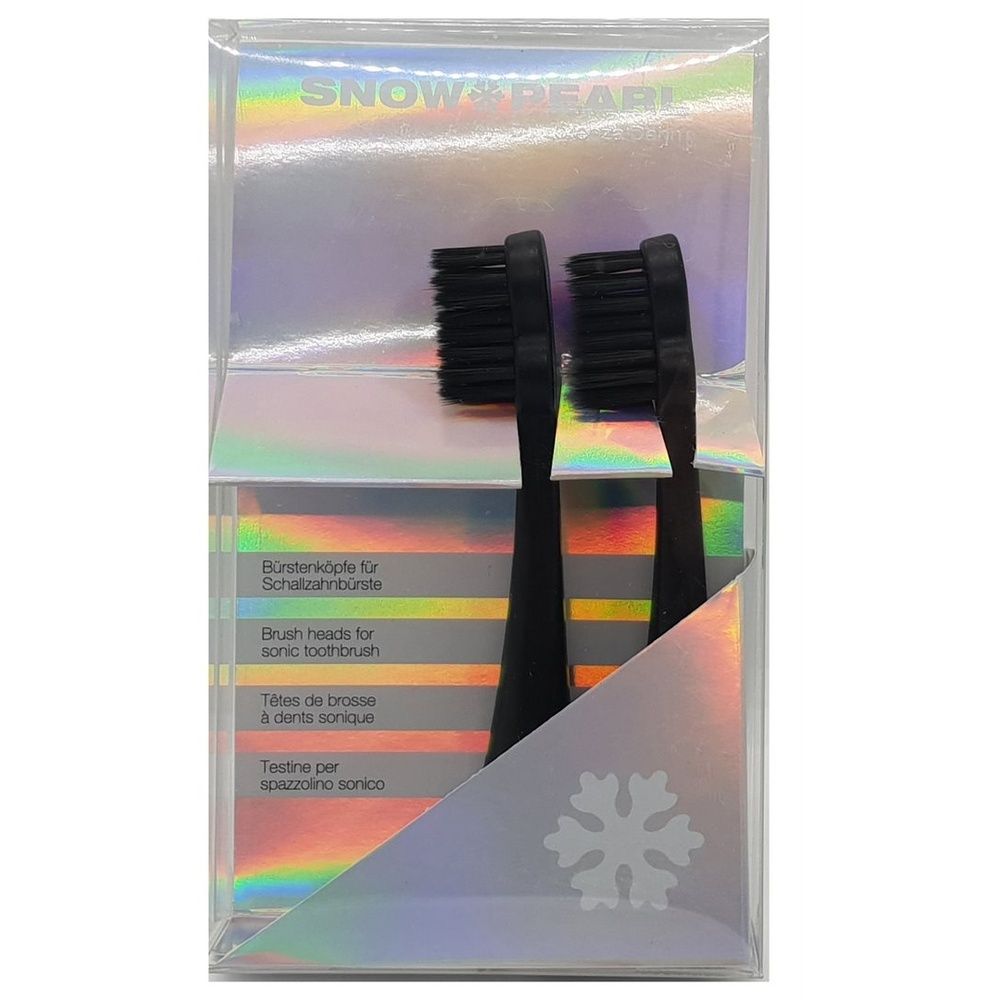 Deux têtes de brosse noires dans un emballage transparent. Inscription : SNOW PEARL. Texte en allemand, anglais, français et italien.