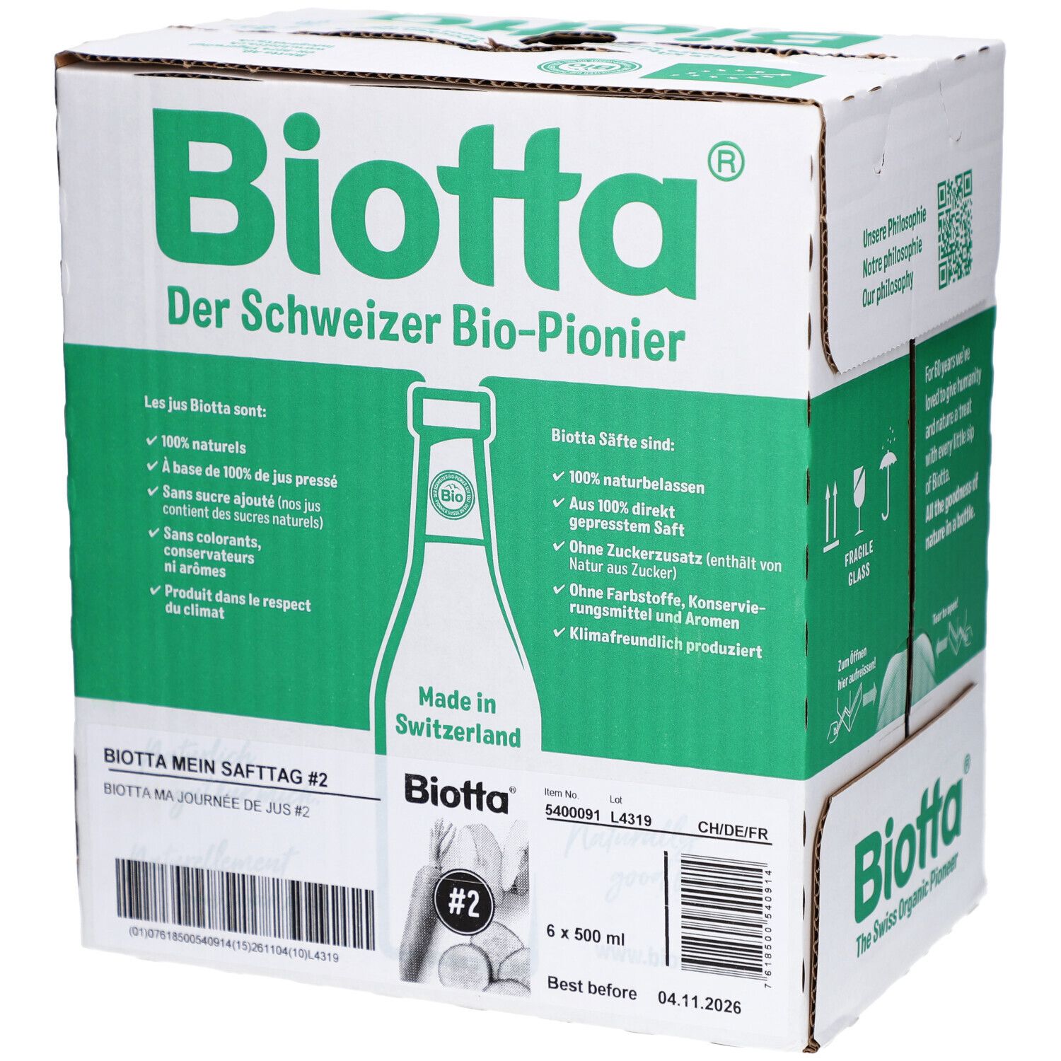 Carton BIOTTA avec texte vert. Texte: "Ma journée de jus #2", "6 x 500 ml", "A consommer de préférence avant".