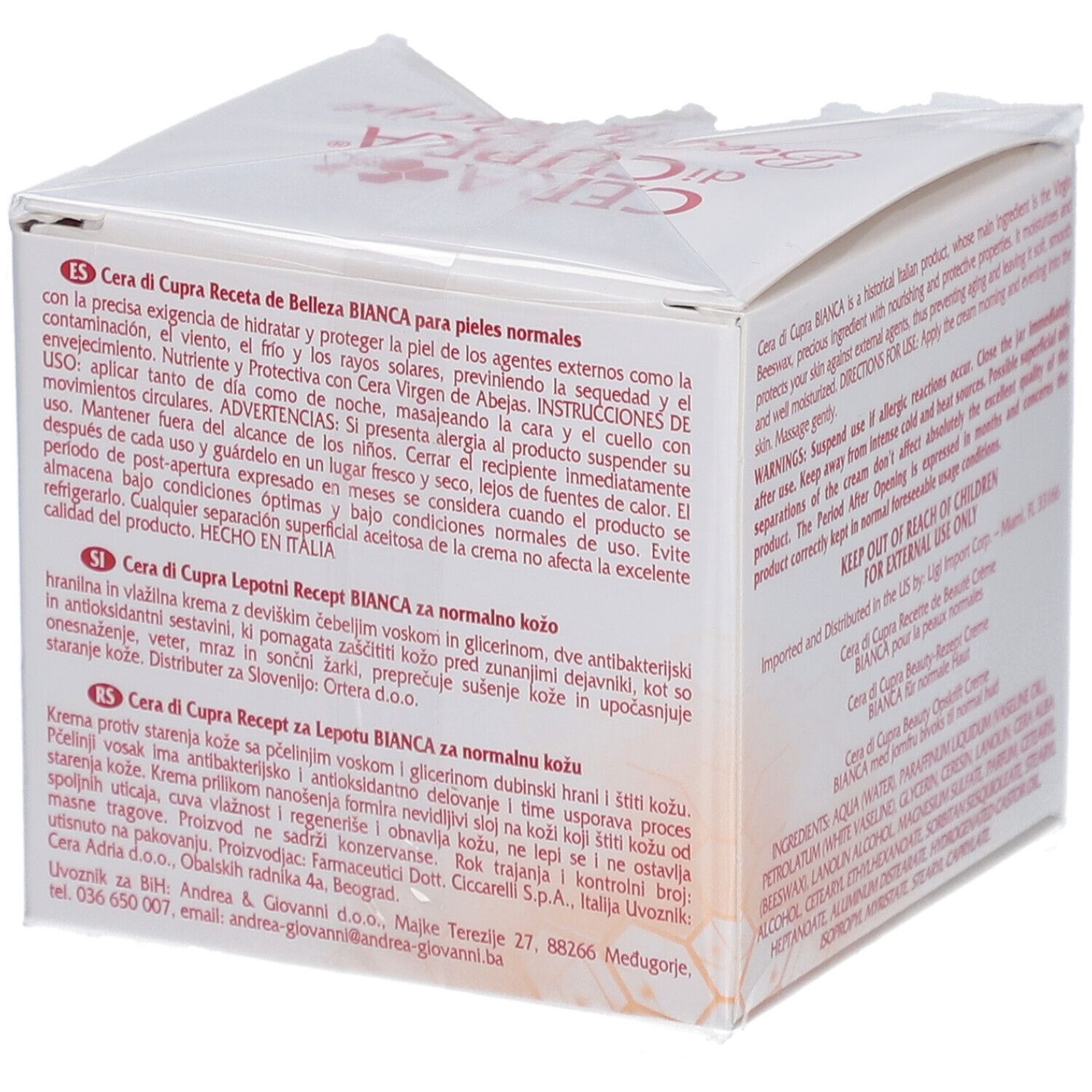 Boîte pliante blanche avec texte en espagnol. Contient informations produit et avertissements. Fabriqué en Italie.