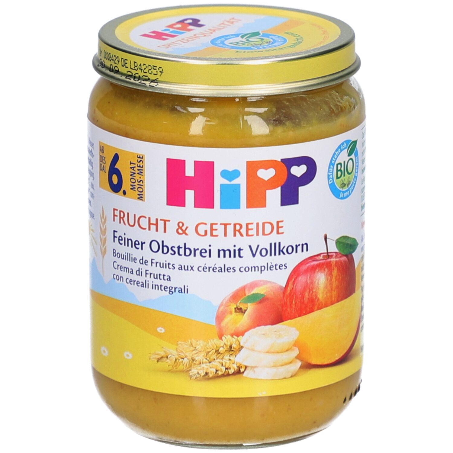 Hipp Fruit & Céréales Bouillie de Fruits aux Céréales Complètes dans un bocal en verre avec couvercle jaune.