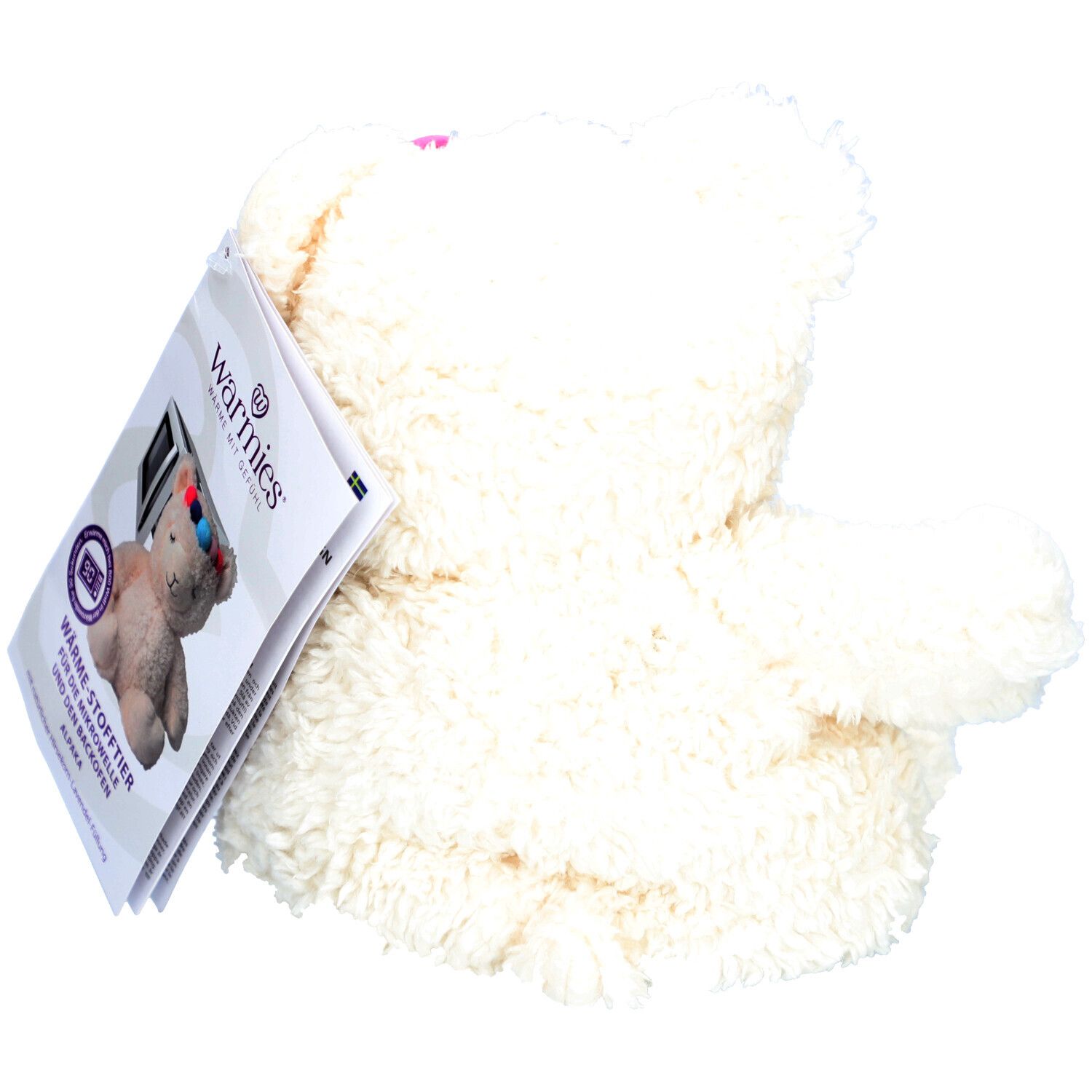 Vue arrière de la peluche alpaga blanche avec étiquette. Le nom de la marque Warmies est visible.