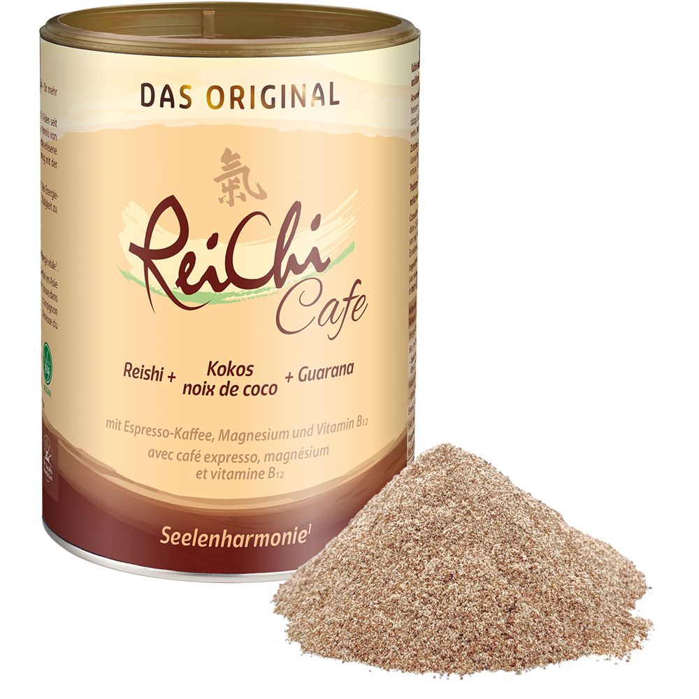 Boîte ReiChi Cafe et poudre. Boîte avec inscription. À côté, un tas de poudre brune. Contient Reishi, noix de coco, guarana.