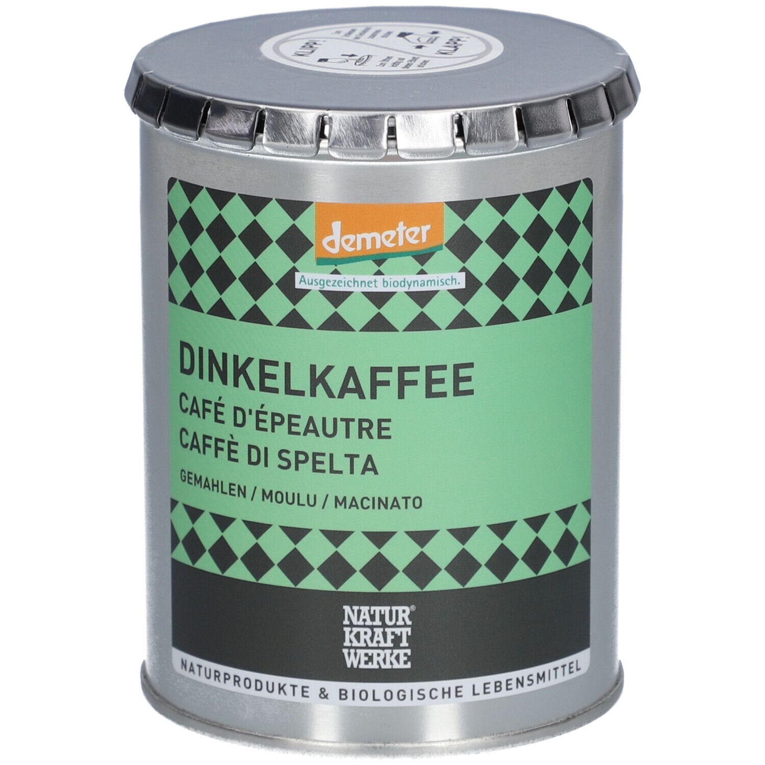 Récipient métallique cylindrique avec étiquette verte. Inscription: Dinkelkaffee, Café d'épeautre, Caffè di Spelta. Label Demeter.