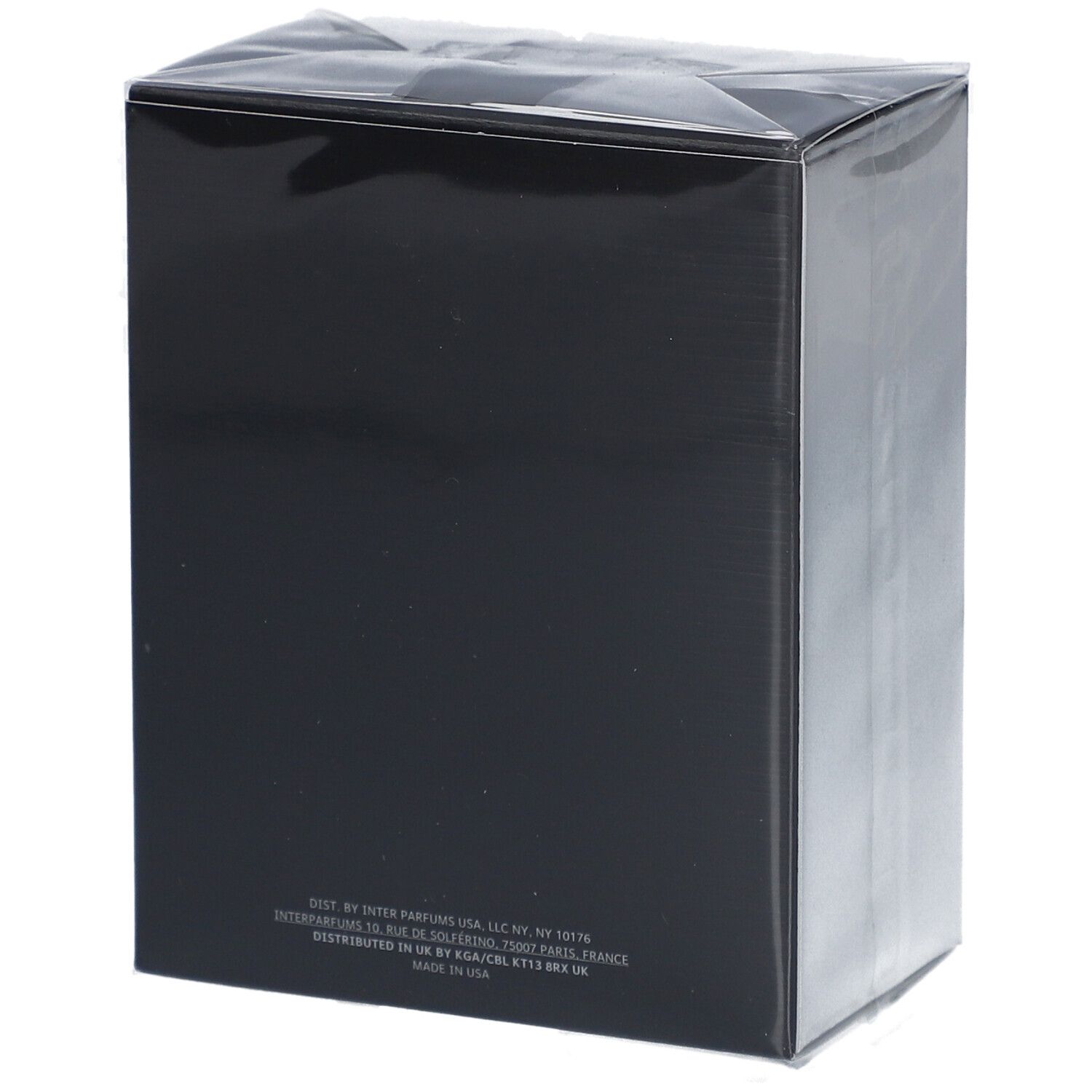 Boîte noire avec texte au dos. Informations du fabricant et ingrédients.