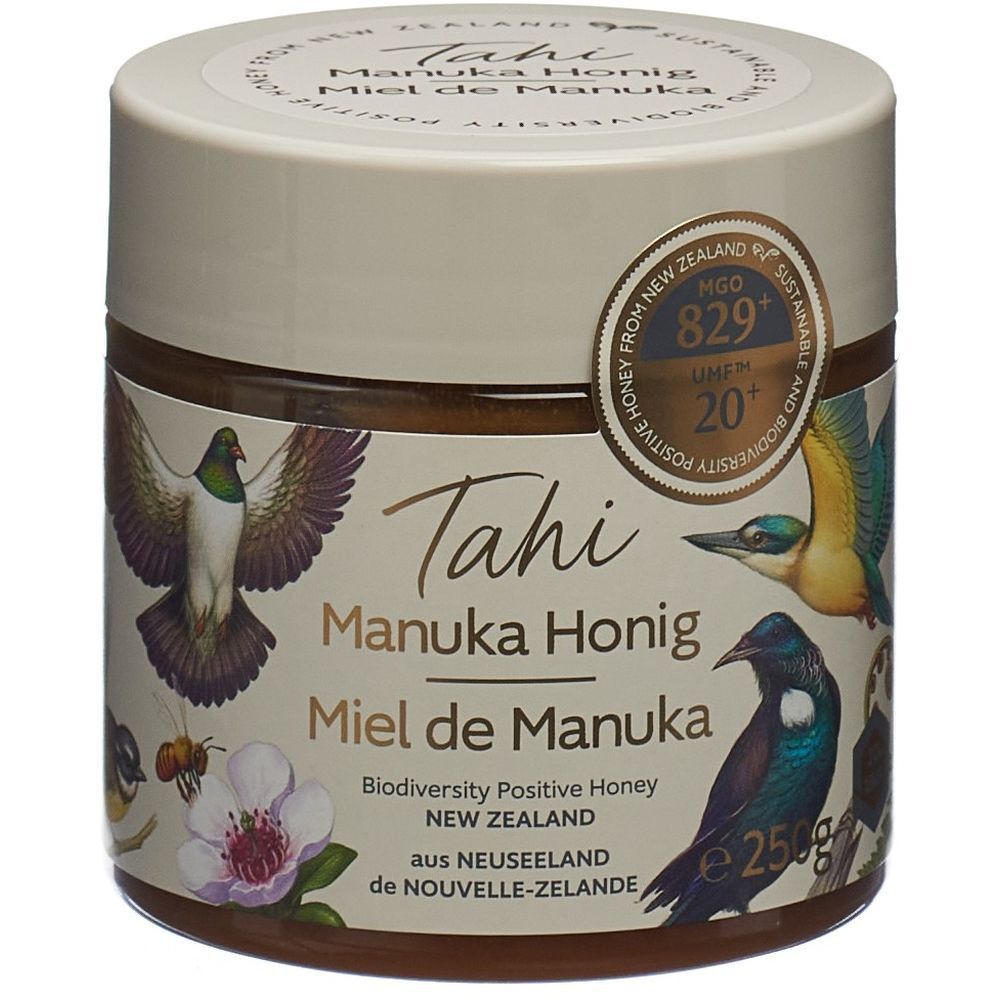 Pot de miel. Inscription: Tahi Manuka Honig, Miel de Manuka. Certificat UMF 20+ MGO 829+. Illustrations d'oiseaux.
