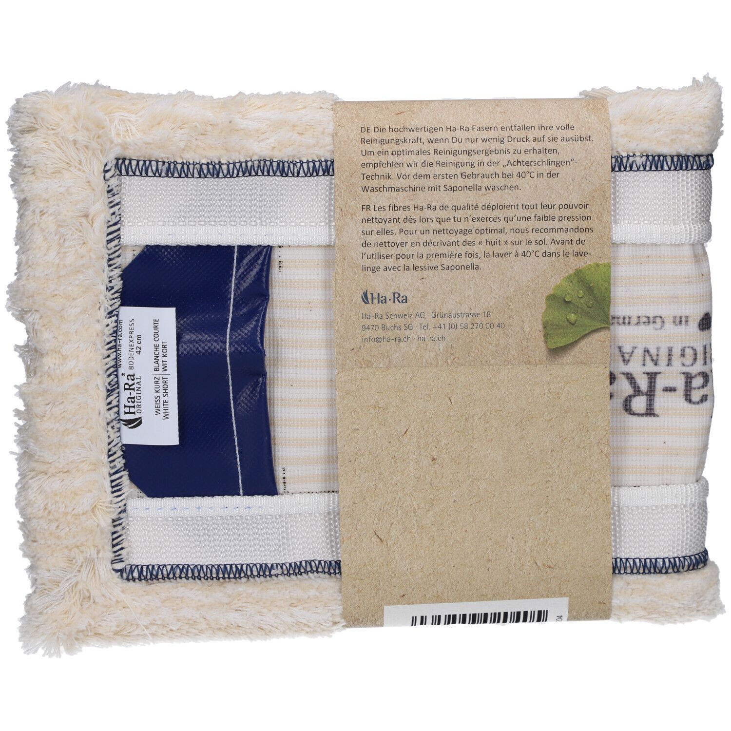 Fibre sol blanche courte. Fibre rectangulaire avec fermeture bleue. Bande de papier avec texte et logo. Logo "Ha-Ra" visible.