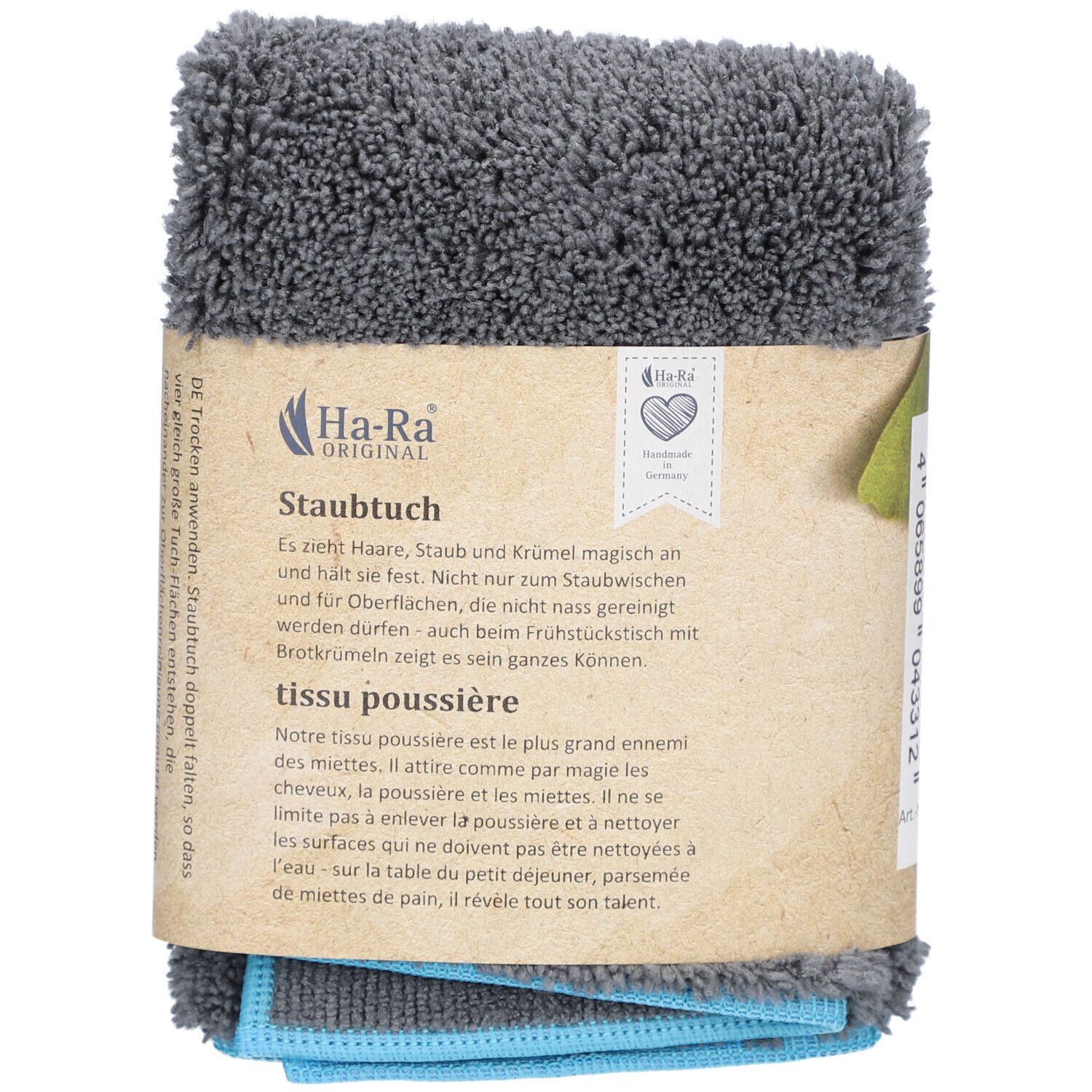 Tissu HA-RA gris plié et emballé. Bande de carton marron avec logo et texte. Tissus bleus et gris visibles.