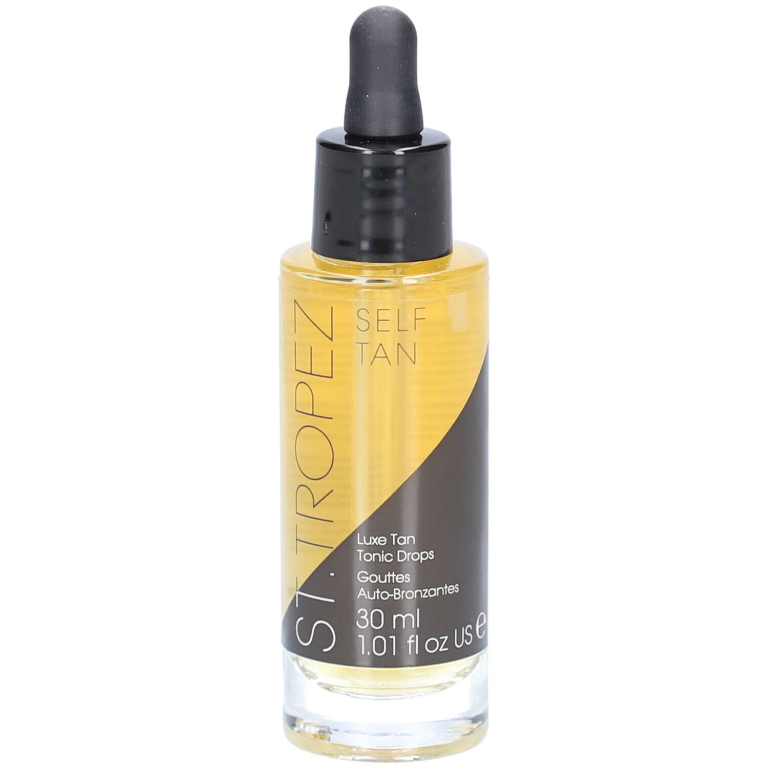 Flacon en verre contenant un liquide ambré, avec bouchon noir et pipette. Inscription: SELF TAN, Luxe Tan Tonic Drops.