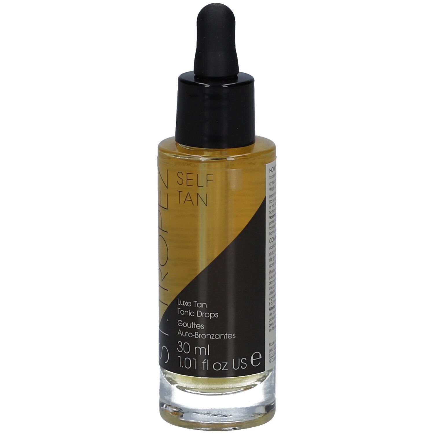 Flacon en verre contenant un liquide ambré, avec bouchon noir et pipette. Inscription: SELF TAN, Luxe Tan Tonic Drops.