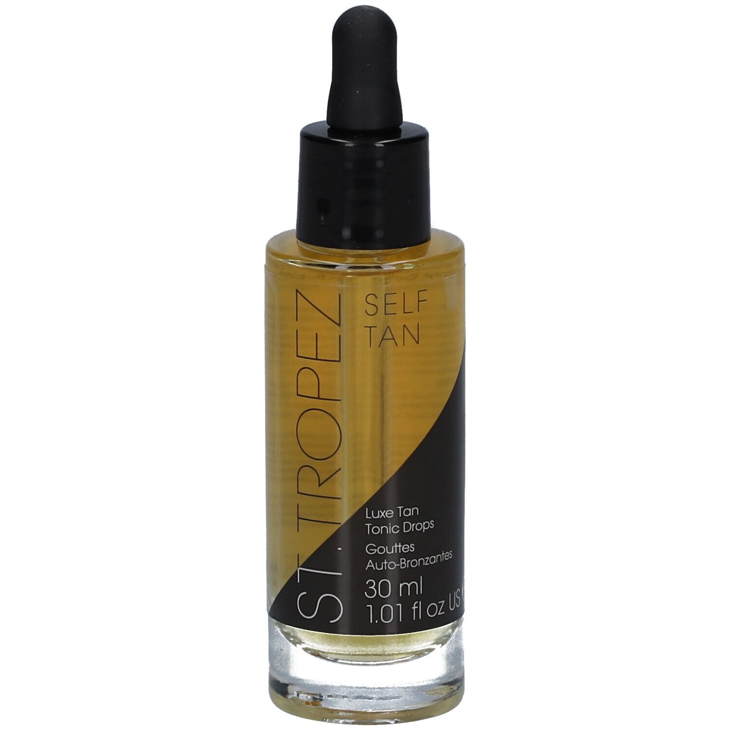 Flacon en verre contenant un liquide ambré, avec bouchon noir et pipette. Inscription: SELF TAN, Luxe Tan Tonic Drops.