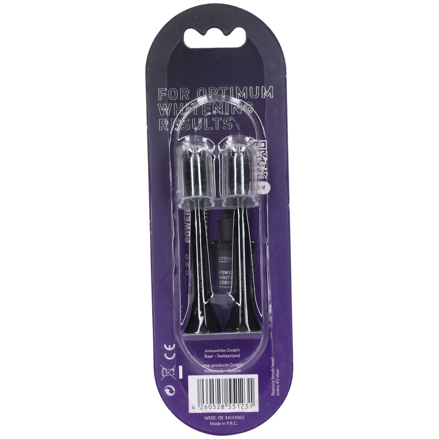 Deux têtes de brosse de rechange dans un emballage blister. Brosses noires avec supports transparents. Inscription : "FOR OPTIMUM WHITENING RESULTS".