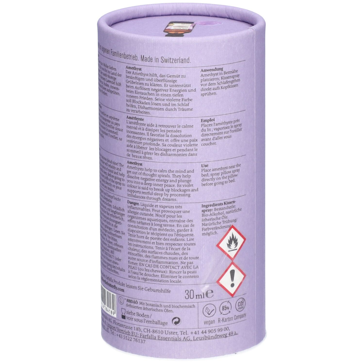 Emballage cylindrique, lilas clair. Texte et pictogrammes sur le côté. Avertissements et ingrédients. Fabriqué en Suisse.