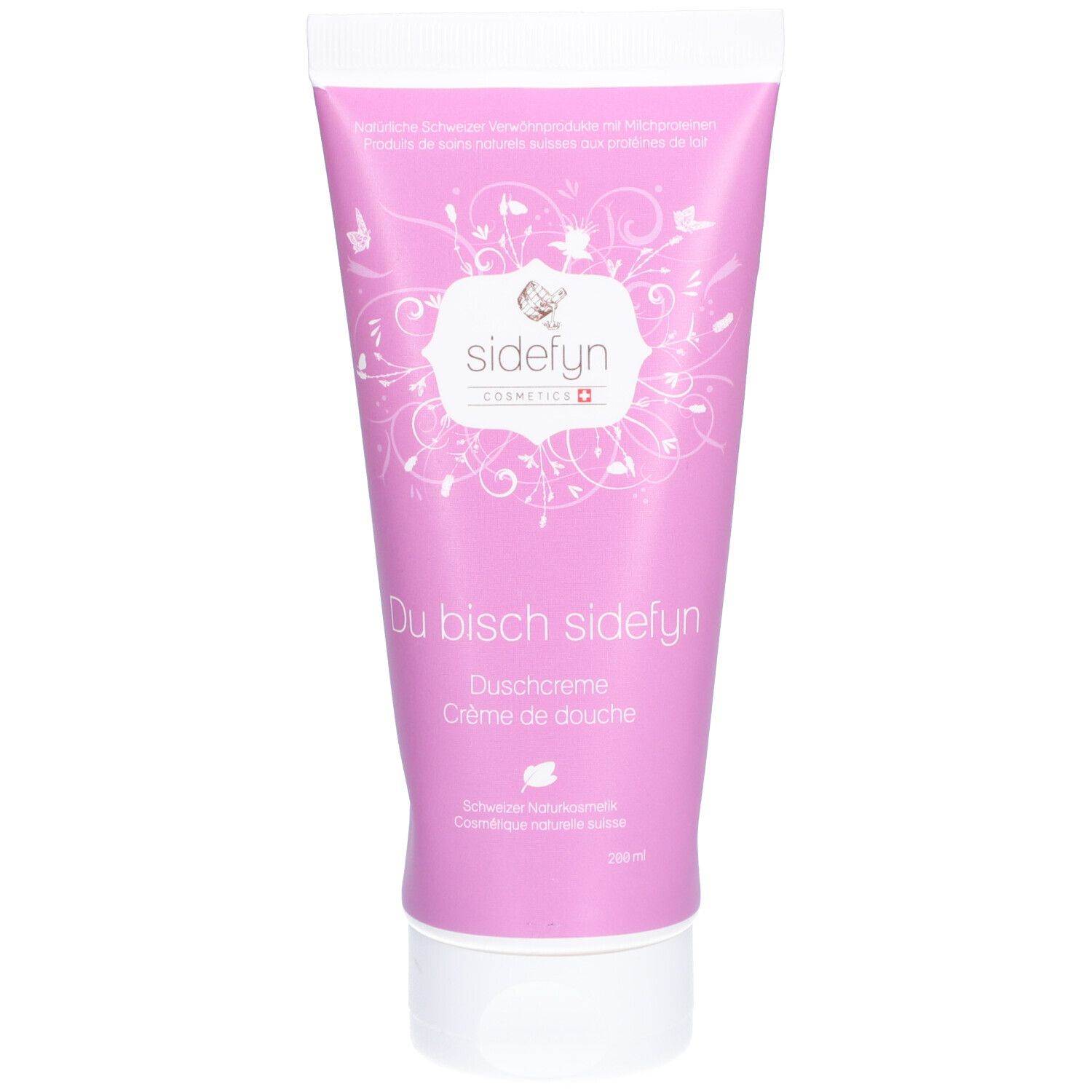 Tube rose avec bouchon blanc. Inscription : Sidefyn, Du bisch sidefyn, Crème de douche. Cosmétiques naturels suisses.