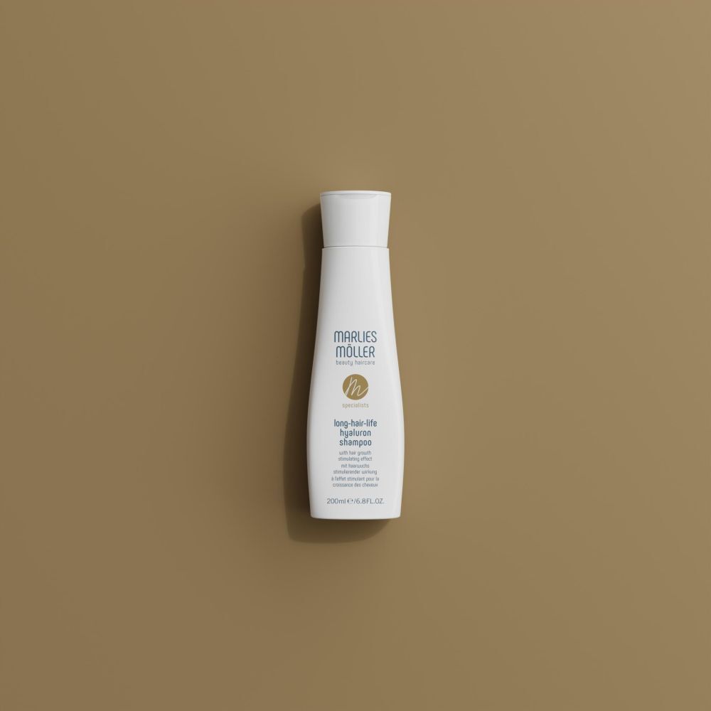 Flacon de shampooing blanc avec bouchon blanc. Inscription: Marlies Möller, Lang-Haar-Life Hyaluron Shampoo.