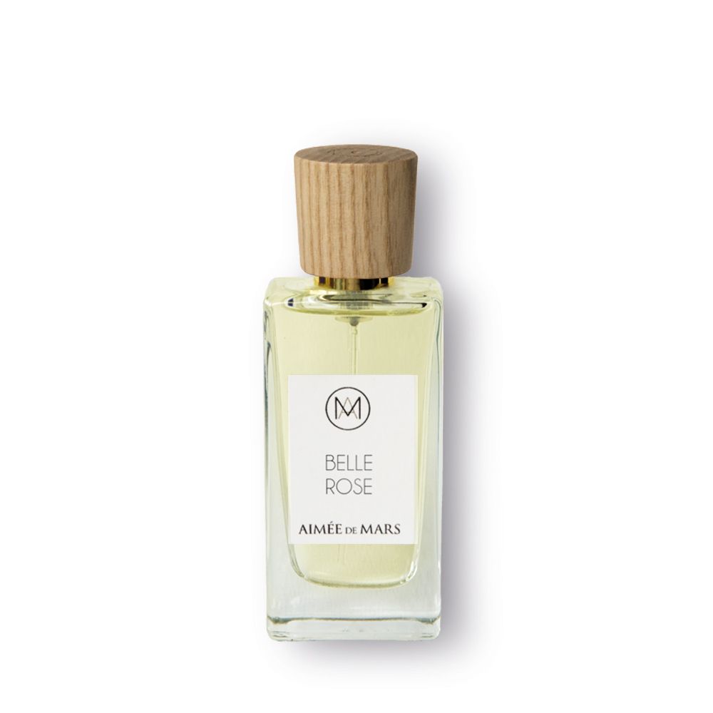 Flacon Aimée de Mars Belle Rose Eau de Parfum. Bouteille rectangulaire en verre, bouchon en bois. Étiquette blanche avec logo et texte.