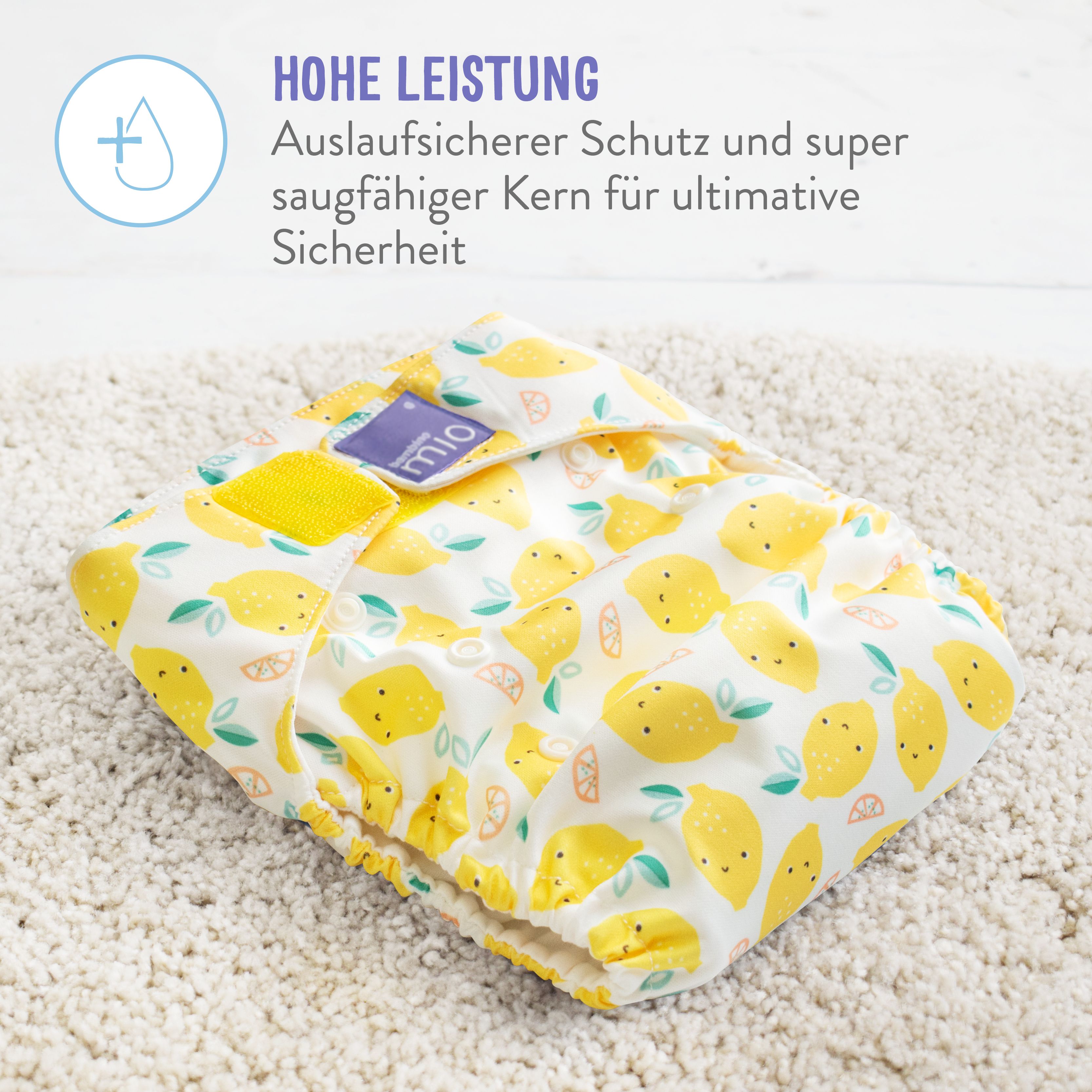 Couche lavable jaune à motifs de citrons. Texte : Haute performance, protection anti-fuites et cœur super absorbant.