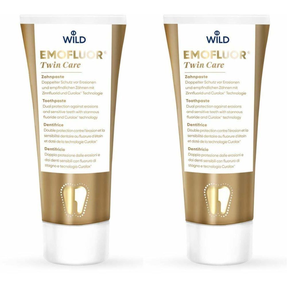 Deux tubes de dentifrice, or et blanc. Inscription: EMOFLUOR Twin Care, dentifrice. Logo: Wild.