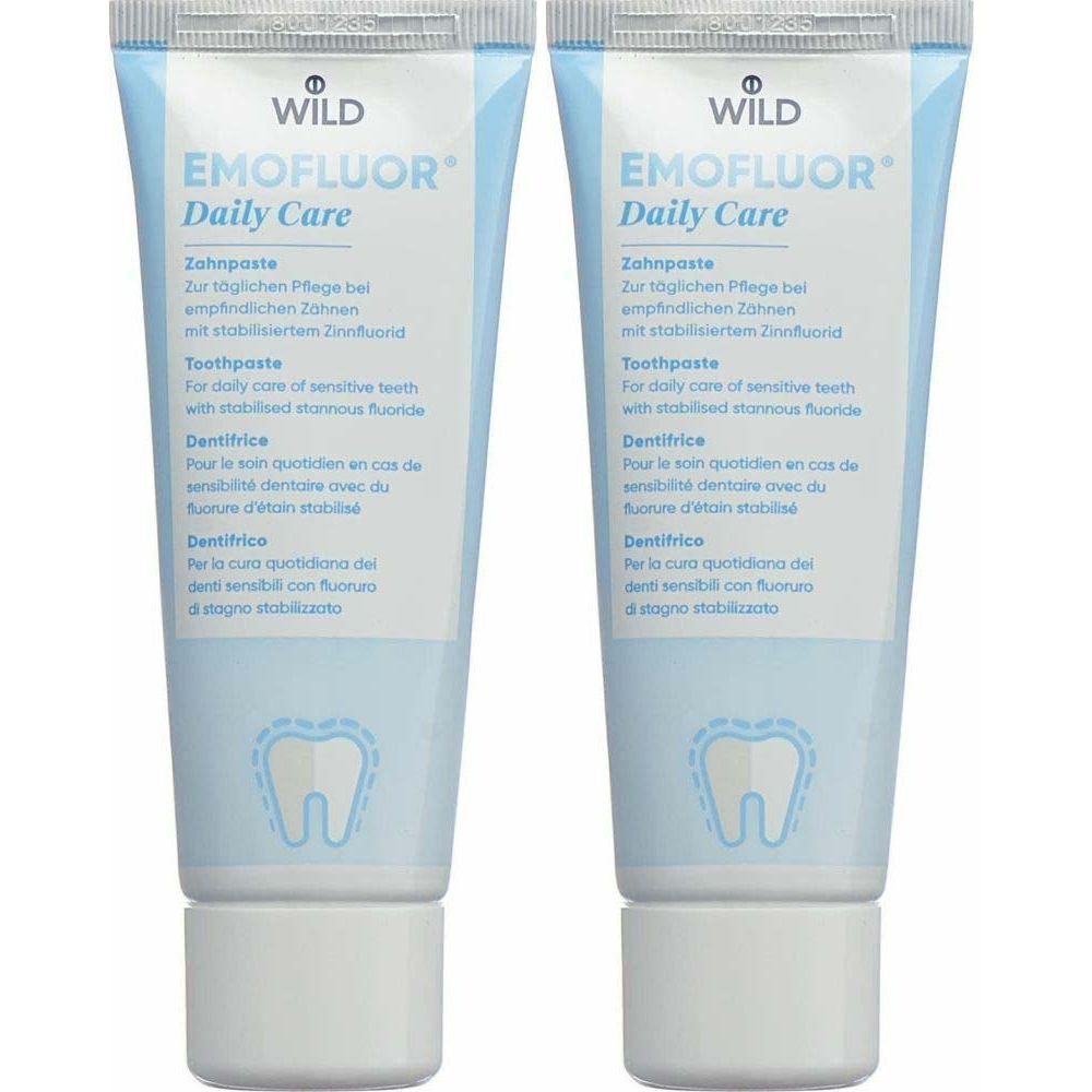 Deux tubes de dentifrice EMOFLUOR Daily Care. Inscriptions en allemand, anglais, français et italien. Bouchon blanc.