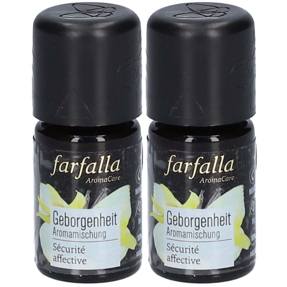 Deux flacons noirs. Inscription: farfalla AromaCare, Geborgenheit Aromamischung, Sécurité affective. Fleur jaune.