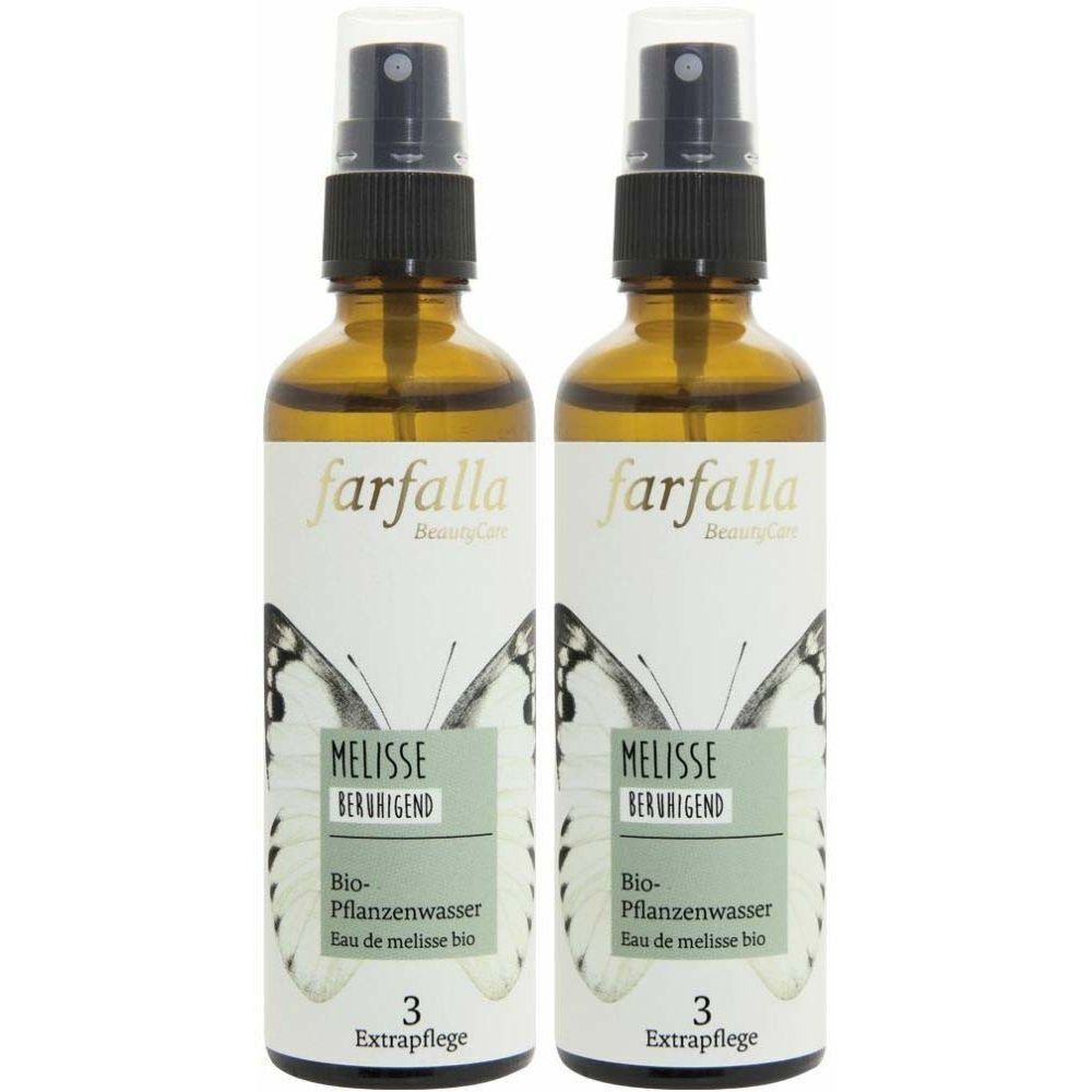 Deux flacons en verre brun avec vaporisateur. Les étiquettes indiquent "farfalla", "Melisse beruhigend" et "Bio-Pflanzenwasser".