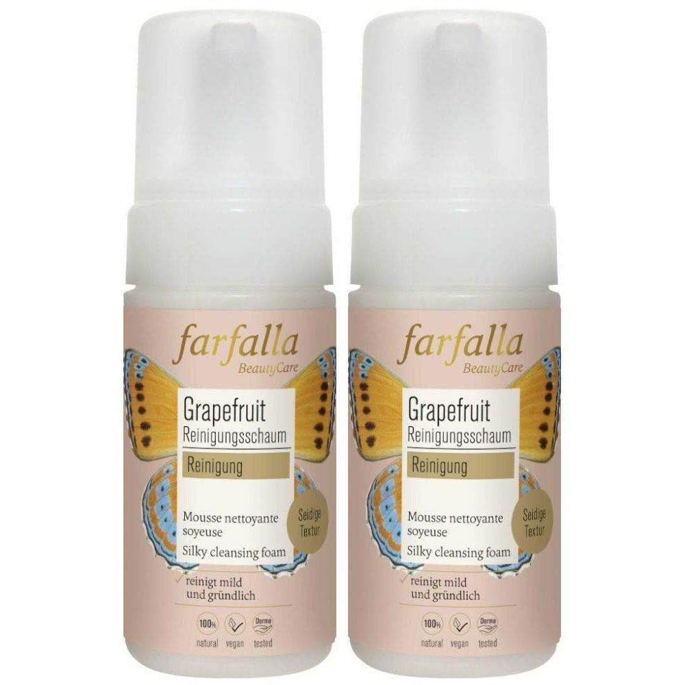 Deux flacons de mousse nettoyante "farfalla Grapefruit". Flacons blancs avec étiquette rose, texte en allemand et papillon.