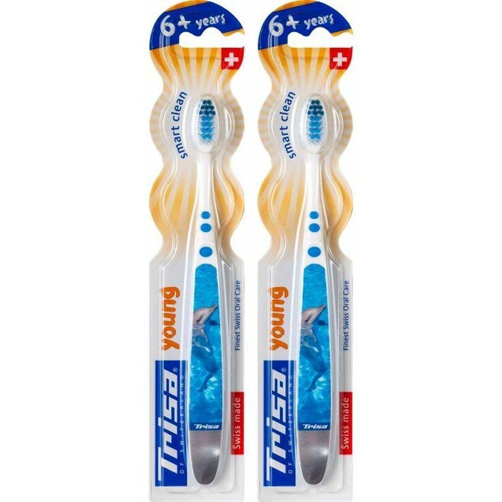 Deux brosses à dents emballées. Manches blancs avec accents bleus. Soies bleues. Marque : Trisa. Pour enfants de 6 ans et plus.