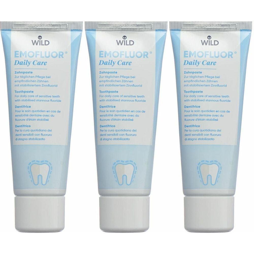 Trois tubes de dentifrice EMOFLUOR Daily Care. Tubes bleu clair avec bouchon blanc. Texte en allemand, anglais, français et italien.