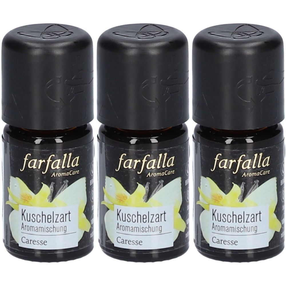 Trois petites bouteilles avec des bouchons noirs. Les étiquettes indiquent "farfalla AromaCare", "Kuschelzart" et "Caresse".