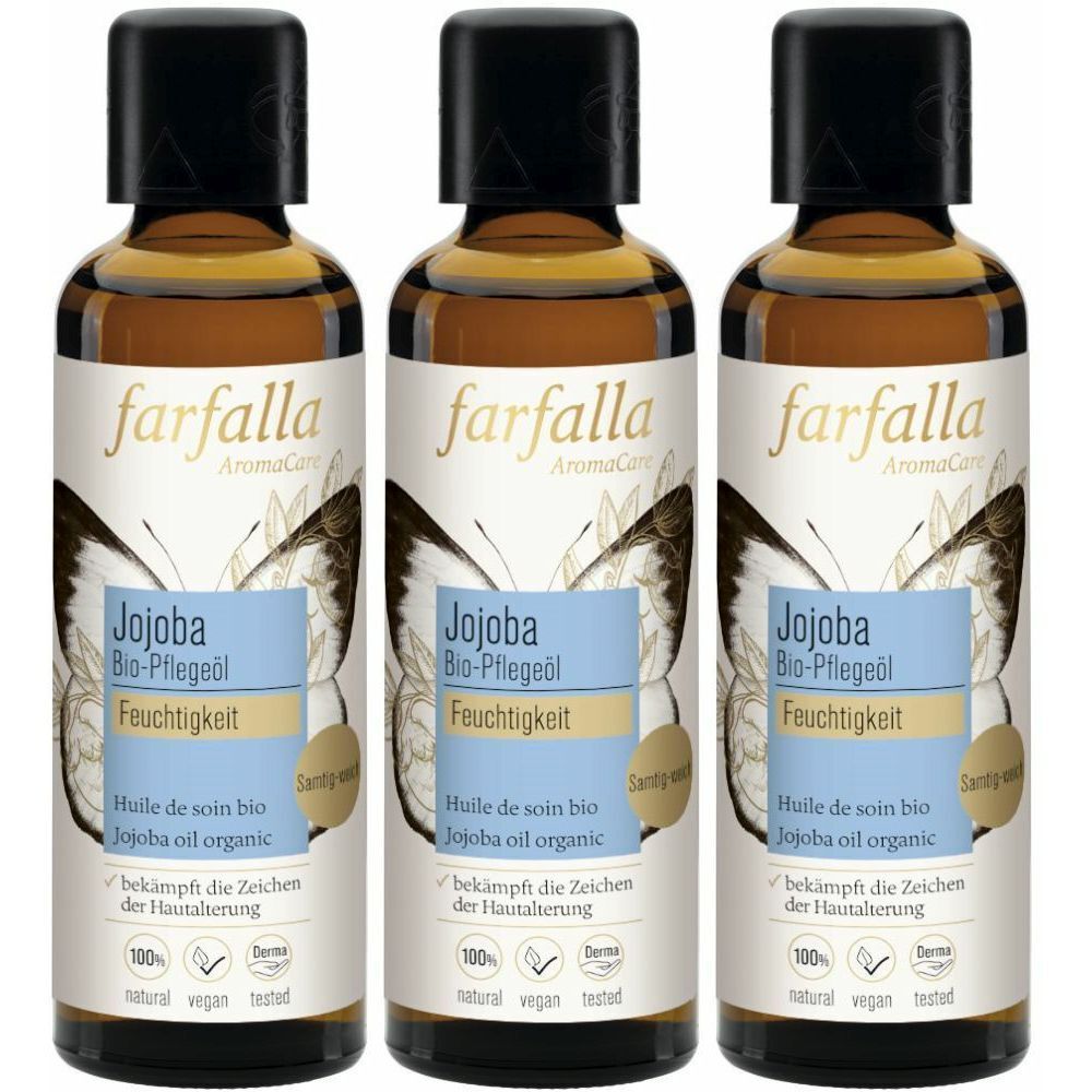 Trois flacons d'huile de jojoba bio FARFALLA. Flacons en verre brun avec bouchon noir et étiquette avec informations et motif papillon.