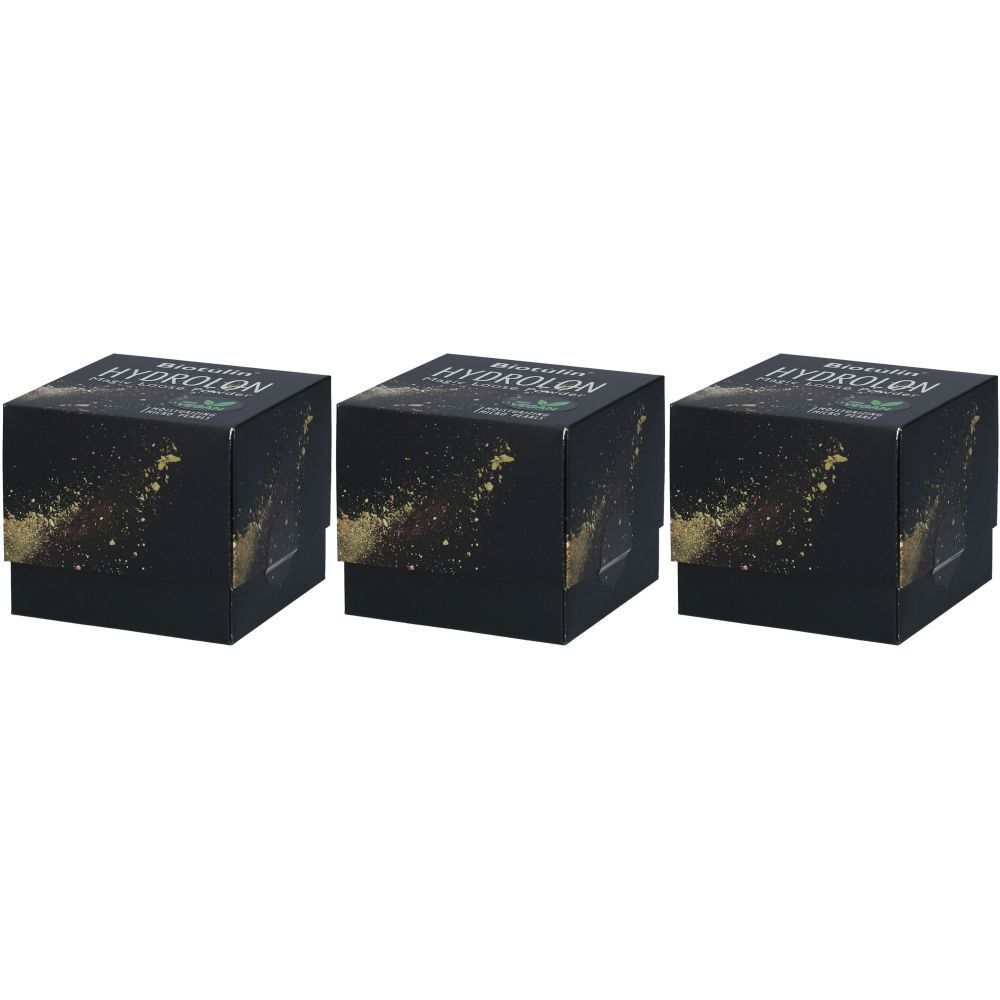 Trois boîtes carrées noires. "HYDROLON" et "Biotulin" sont visibles. Des éclaboussures dorées ornent le devant.