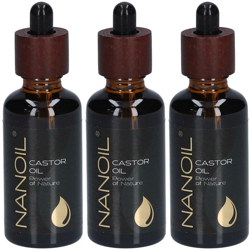 Trois flacons d'huile brune. Chaque flacon porte l'inscription "NANOIL CASTOR OIL Power of Nature". Les flacons ont un bouchon en bois.
