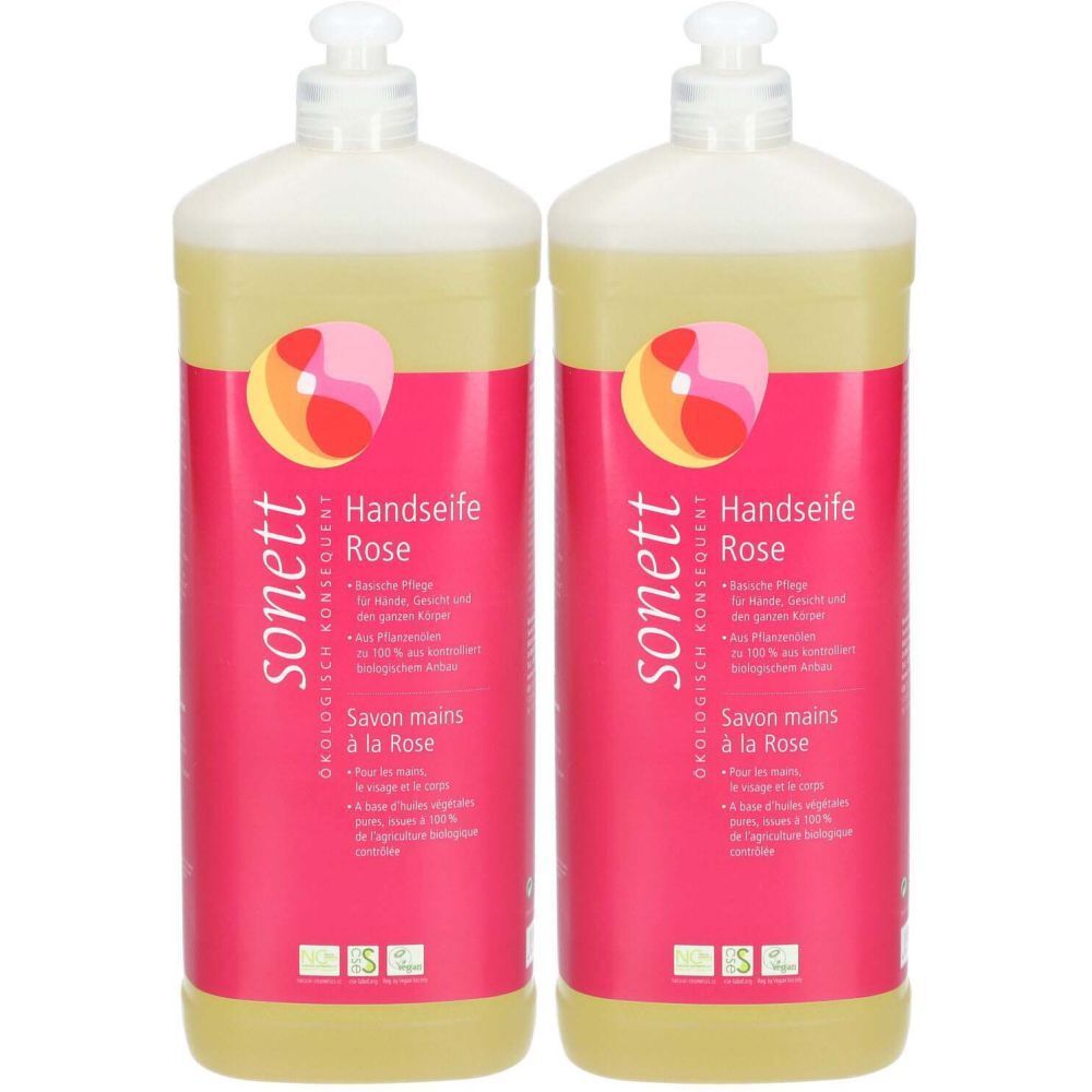 Deux flacons de savon pour les mains à la rose. Étiquette rose avec nom du produit et logo. Tête de distributeur blanche.