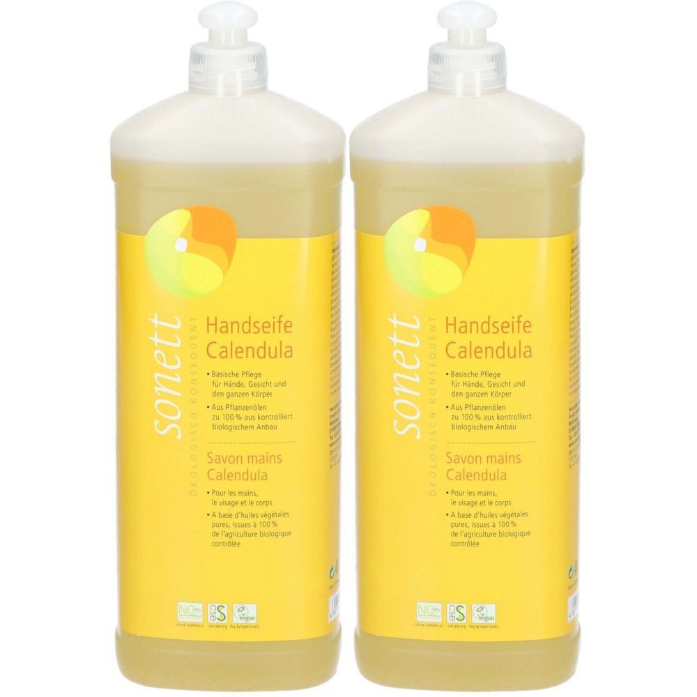 Deux flacons de savon liquide avec étiquette jaune. Inscription : Handseife Calendula, sonett. Avec distributeur.