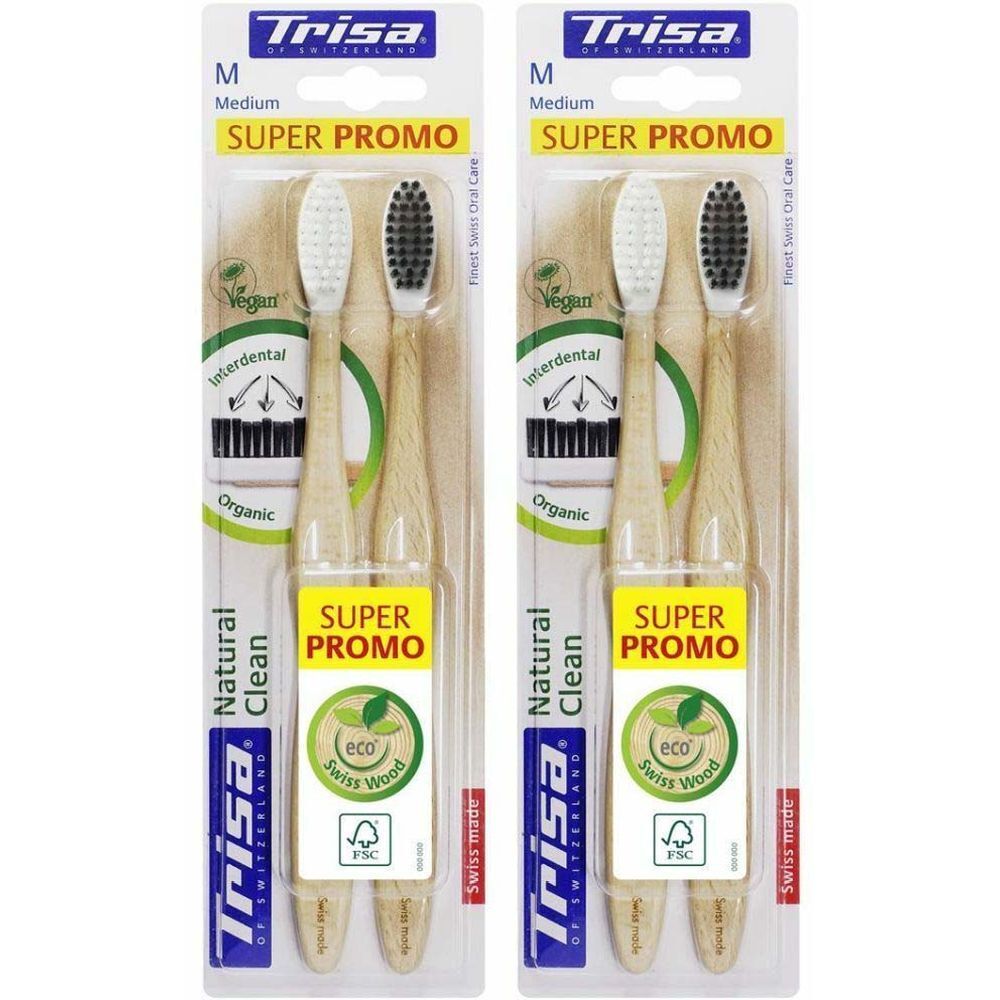 Deux brosses à dents dans un emballage blister. Manches brun clair, soies blanches et noires. Inscription : Trisa, Super Promo, Natural Clean.