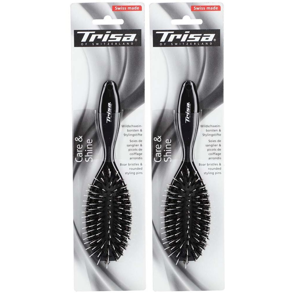 Deux brosses à cheveux dans leur emballage. Manche noir, soies et picots arrondis. Marque : Trisa.