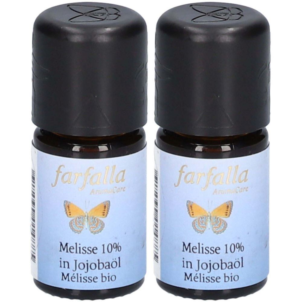 Deux petites bouteilles en verre brun avec des bouchons noirs. Les étiquettes indiquent "farfalla" et "Melisse 10% in Jojobaöl".