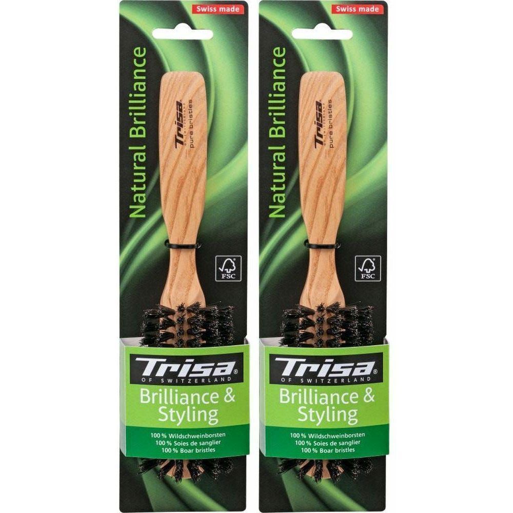 Deux brosses à cheveux dans leur emballage. Manche en bois, soies. Inscription: Trisa, Natural Brilliance, Brilliance & Styling. Label FSC.