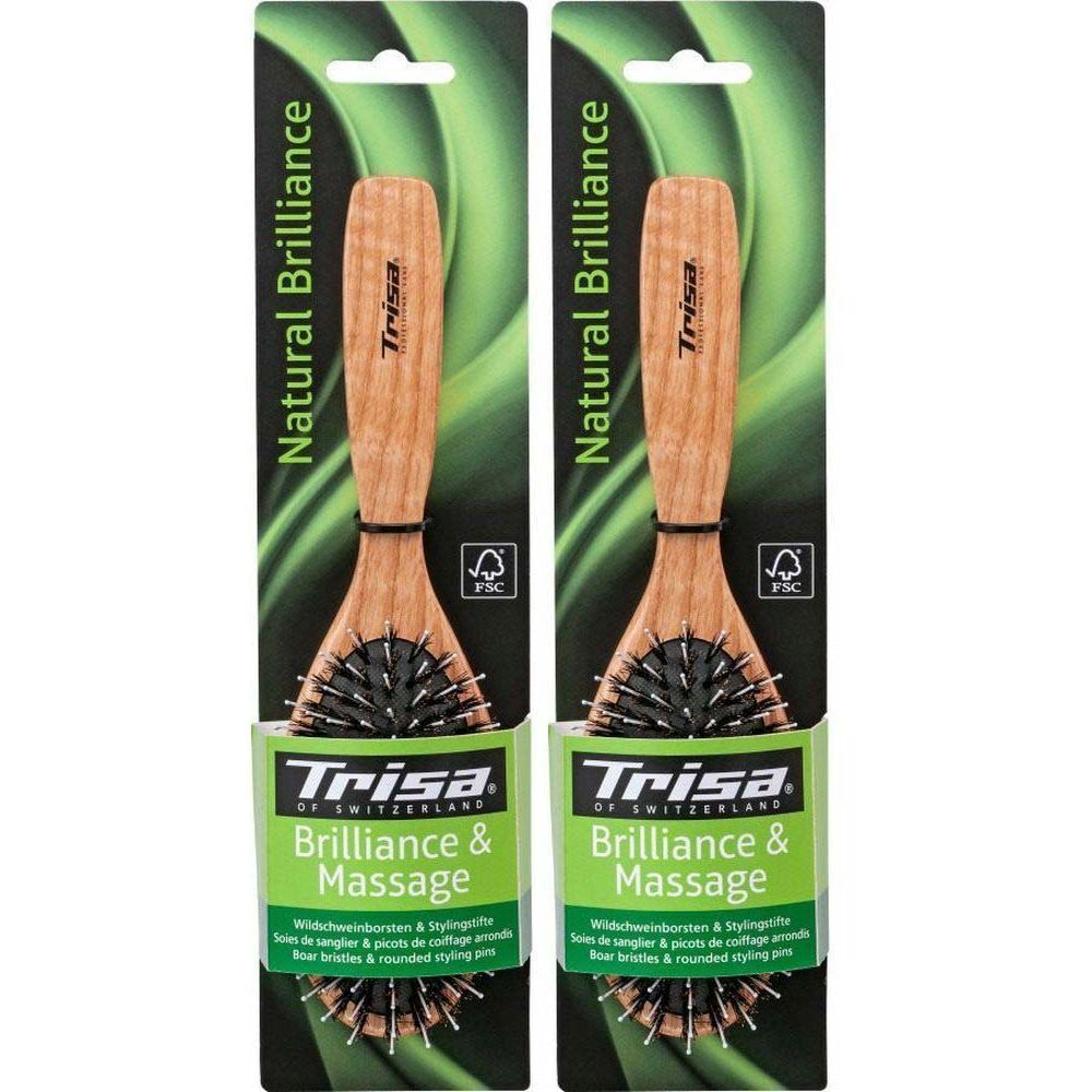 Deux brosses à manche en bois et soies de sanglier, emballées. Inscriptions: Trisa, Natural Brilliance, Brilliance & Massage.