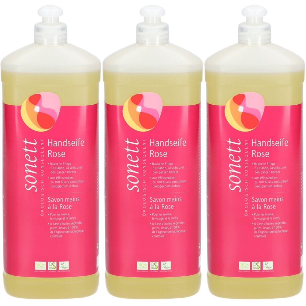 Trois flacons de savon pour les mains à la rose. Étiquette rose avec nom et logo du produit. Liquide transparent, pompe blanche.