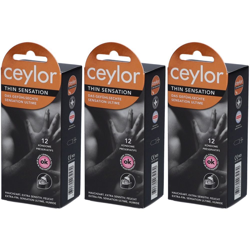 Trois boîtes de préservatifs Ceylor Thin Sensation. Chaque boîte contient 12 préservatifs. Inscription orange, fond noir.