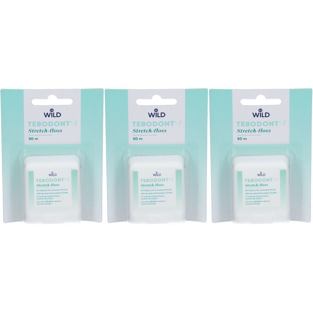 Trois paquets de fil dentaire Tebodont F. Récipients blancs avec des accents verts, sur fond bleu clair. Marque Wild.
