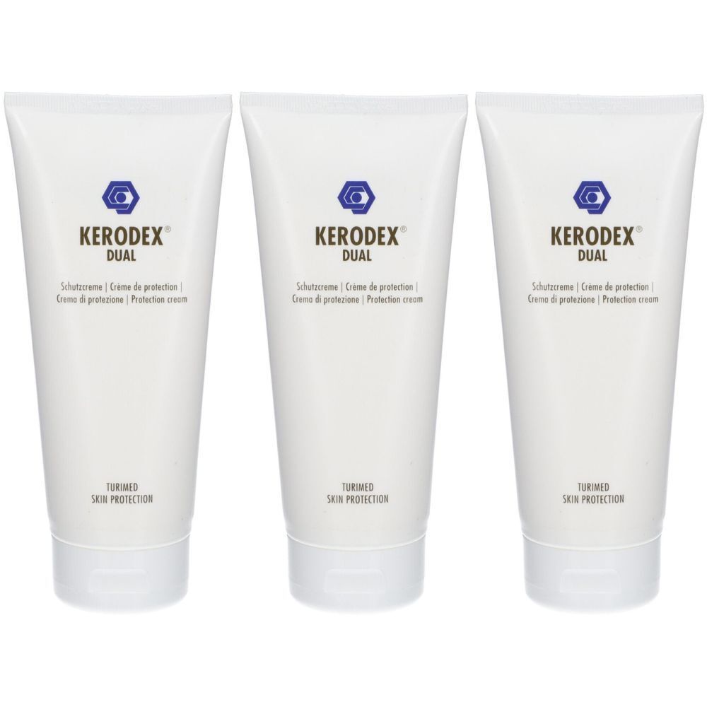 Trois tubes blancs. On lit "KERODEX DUAL" sur chacun. Texte multilingue en dessous. En bas, "TUNED SKIN PROTECTION".