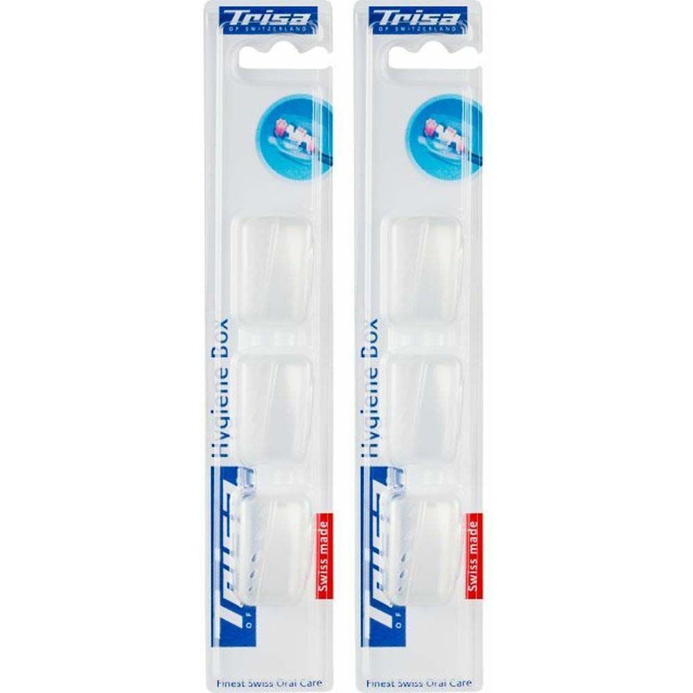 Deux paquets de protège-têtes de brosse à dents transparents. Chaque paquet contient quatre protections. Marque : Trisa. Label "Swiss made".